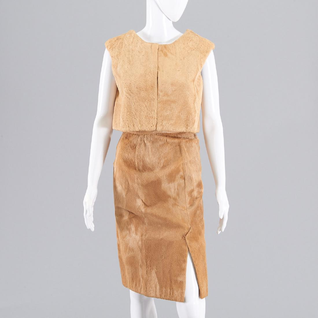 Camel cowhide skirt and vest: Camel cowhide skirt and vest, Circa 1950's/1960's, sleeveless crop vest with hook closure, chiffon lined, 36"b, 15"l, straight fully lined skirt with zip back, front slit, 24"w, 26"l Provenance: From 