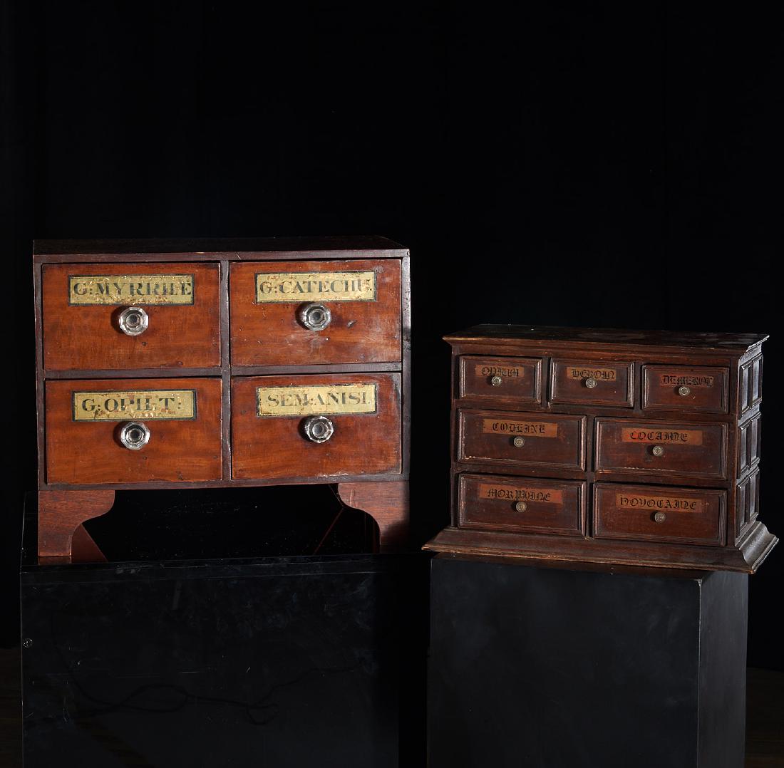 (2) antique and vintage apothecary chests: (2) antique and vintage apothecary chests, 19th and 20th c., one with 7 drawers "opium", "heroin", "demerol", "cocaine", etc., the other with eglomise labels, 10.5"h x 16"w x 8"d and 15"h x 18.5"w x 1