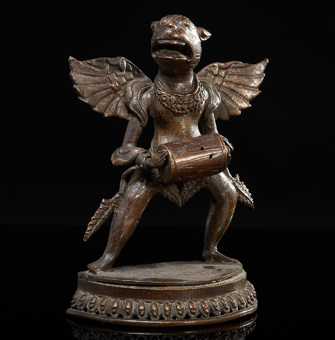 Himalayan bronze model of a wrathful Deity: Himalayan bronze model of a wrathful Deity, 19th/20th c., possibly Nepalese, winged drummer with tiger head, pierced lotus pedal base, 9.75"h x 7"w x 3.5"d