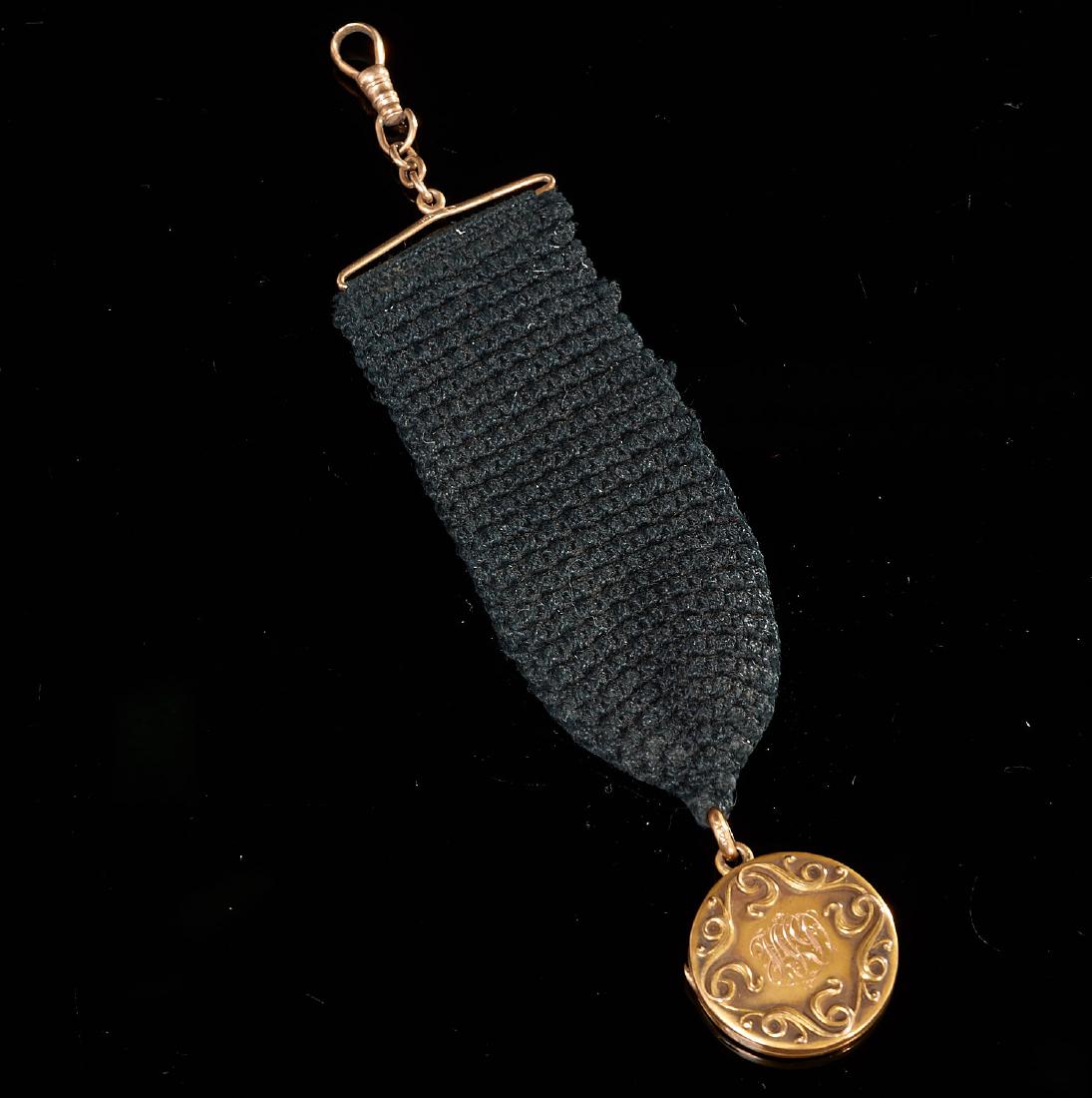 Antique 14K watch fob mourning locket: Antique 14K watch fob mourning locket, 19th/20th c., monogrammed locket on crocheted fob, fob and bale marked "14K", locket tests "14K", 5.75"l, approx. 11.81gms. total (incl. ribbon)