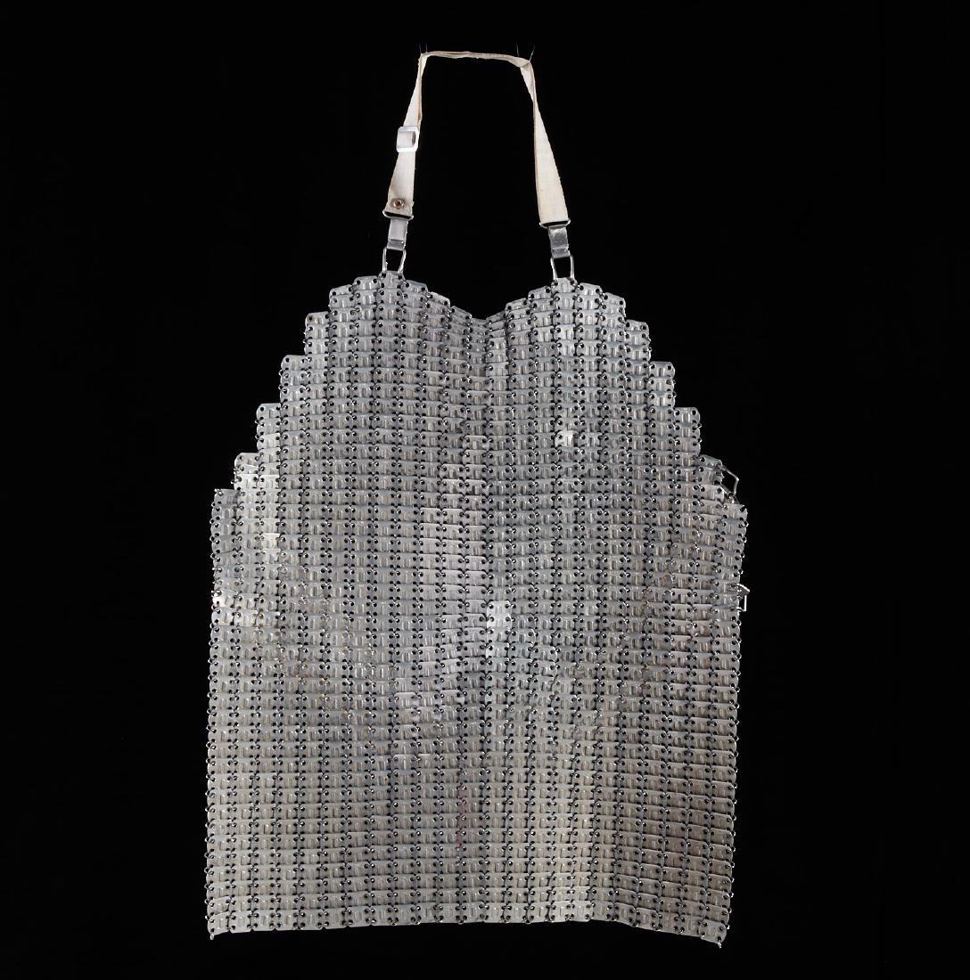 Vintage French chainmail butcher's apron: Vintage French chainmail butcher's apron, c. 1960s, aluminum with nylon straps, stamped "Super Lamex - France", 22"h x 22"w Provenance: The Estate of Amy Perlin, NY