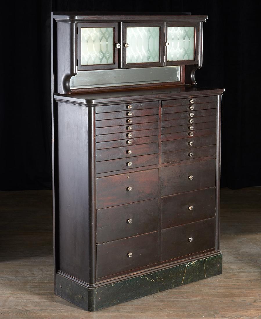 Antique dental cabinet: Antique dental cabinet, 19th/20th c., milk glass lined cabinets and top drawer inserts, mirrored back splash, frosted glass door panels, metal drawers with wooden fronts, 62.75"h 40"w x 13.5"d