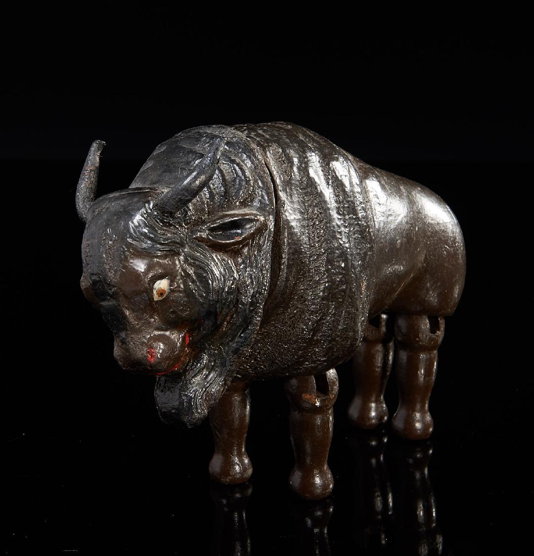 Schoenhut figure: Schoenhut figure, 19th/20th c., American, Philadelphia, carved, painted and articulated buffalo, 6"h x 8"l x 3"w Provenance: A Williamstown Massachusetts collection