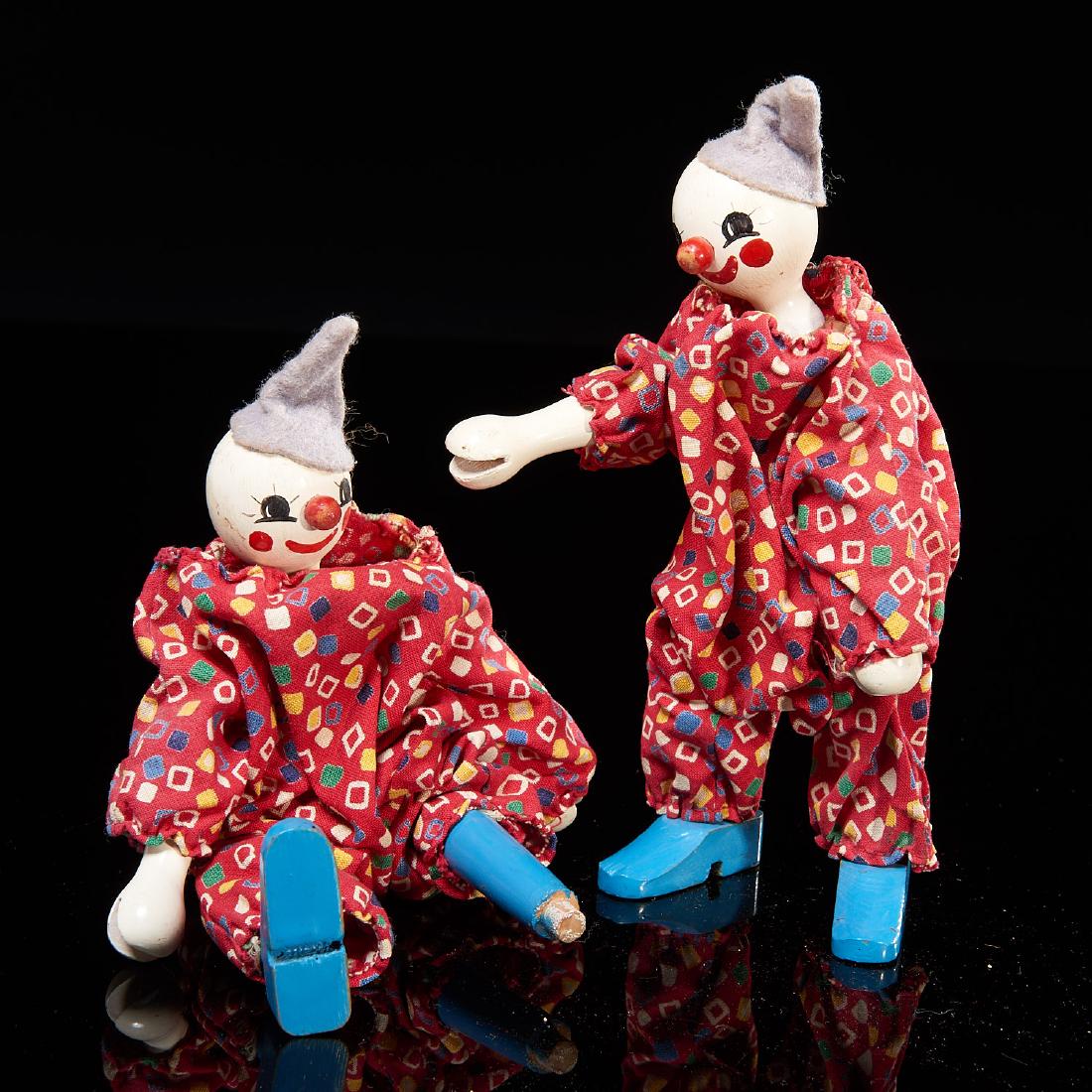 Pair Schoenhut figures: Pair Schoenhut figures, 19th/20th c., American, Philadelphia, two carved, painted clothed and articulated clowns in matching outfits, from "Humpty Dumpty Circus", 6.5"h x 2"l x 3"w Provenance: A Willi