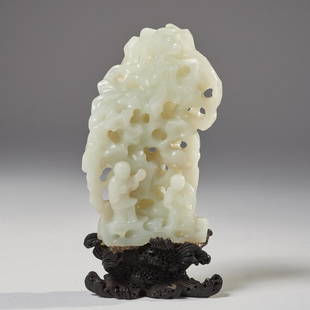 Chinese jade carved scholars mountain: Chinese jade carved scholars mountain, Qing Dynasty, very pale pierced carved celadon jade depicting wooded mountainside fronted with two scholars, on elaborately carved custom hardwood stand in the f