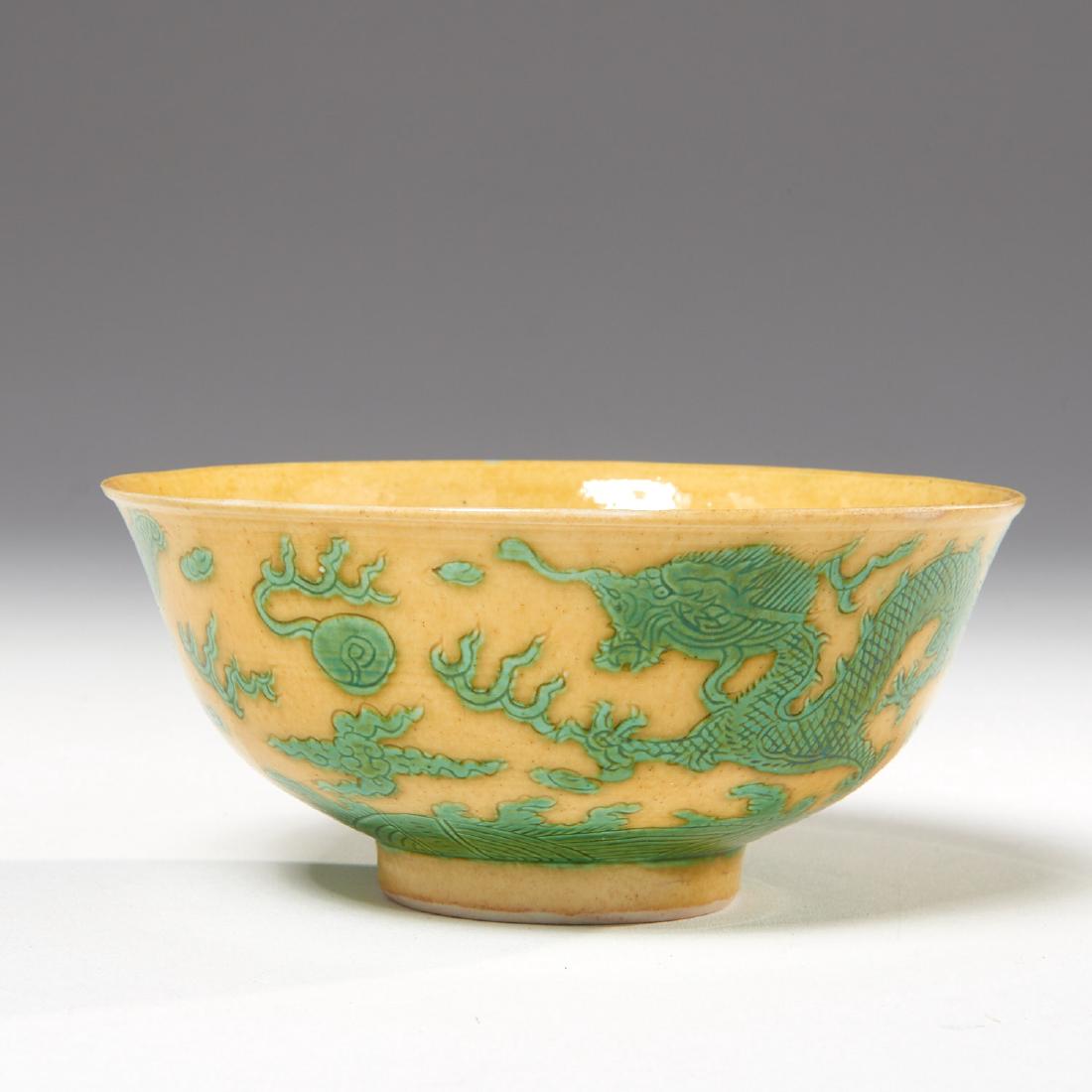 Chinese yellow and green incised Dragon bowl: Chinese yellow and green incised Dragon bowl, Qing Dynasty, decorated with a four-clawed dragon chasing a pearl, underglaze blue Kangxi mark to underside of foot, 2.5"h x 5.25"dia.