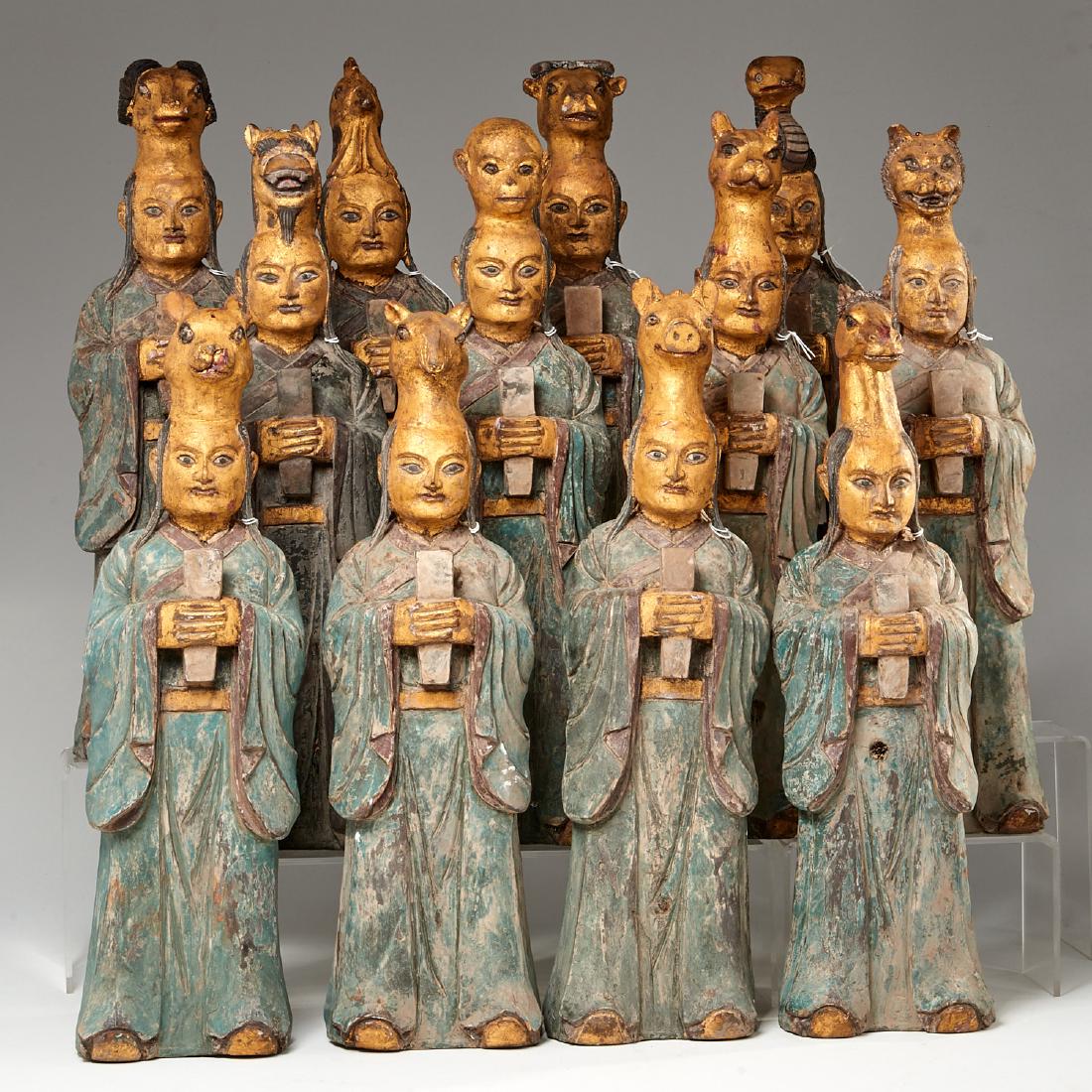(12) Northern Mongolian Zodiac figures: (12) Northern Mongolian Zodiac figures, Possibly late Liao Dynasty (c. 1150), carved wood, each in Mongolian headress holding Hu tablets, each approx. 20"h