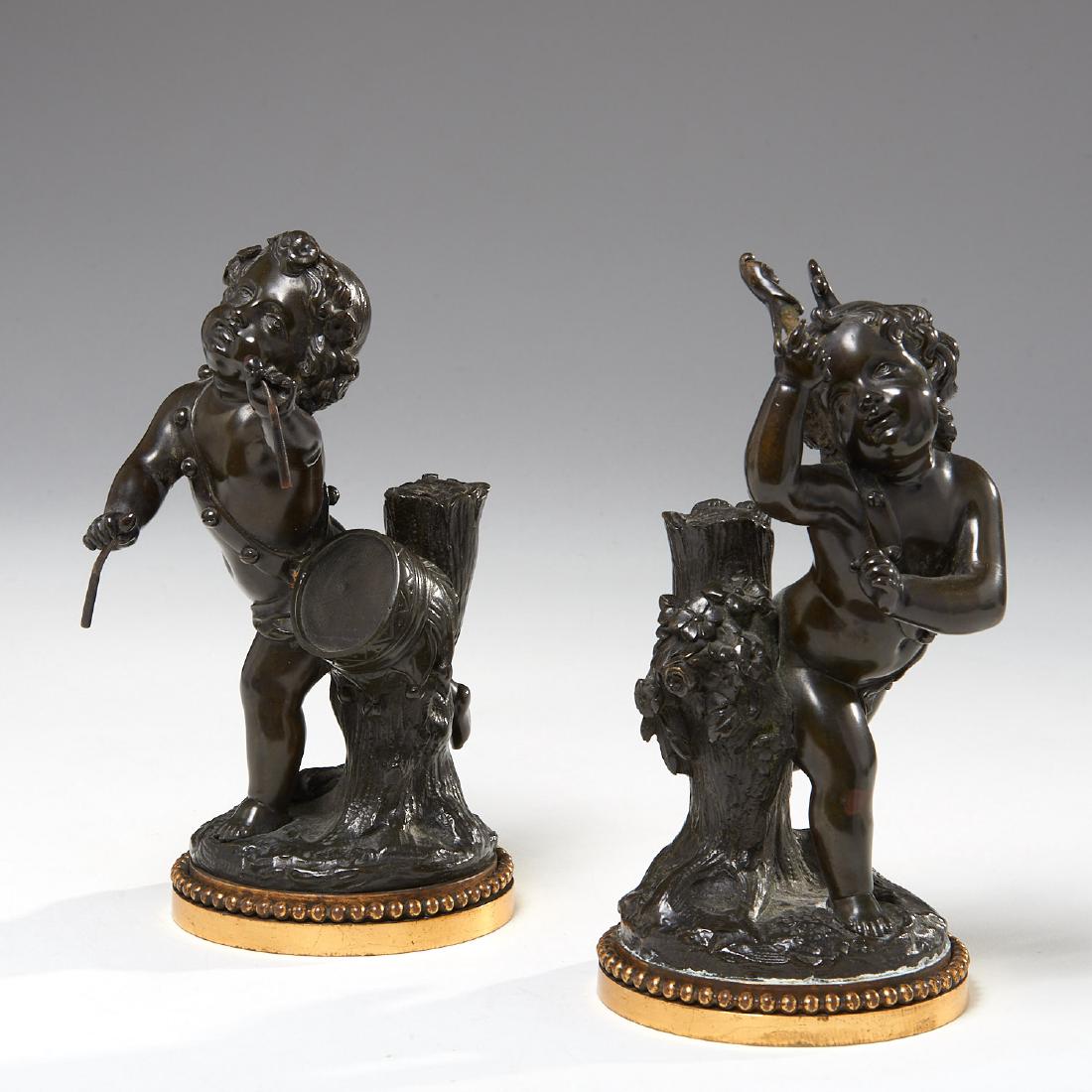 Pair French patinated bronze cherubs: Pair French patinated bronze cherubs, 19th c., France, manner of Clodion, one playing the drum, the other holding a jester puppet, patinated bronze on gilt bronze base, approx. 9"h x 6"l x 4"w