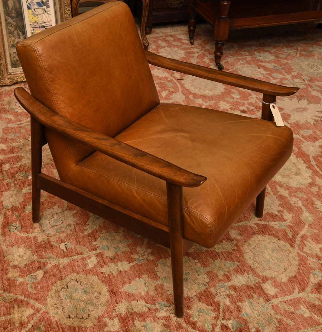 West Elm leather and wood chair: West Elm leather and wood chair, 21st c., "Mid-Century Show Wood" chair in saddle leather, label under seat, 30"h x 26"w x 28"d