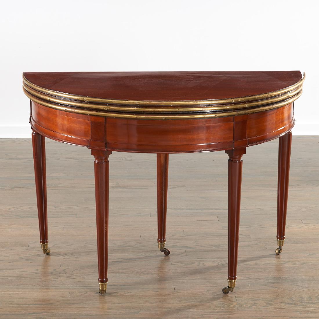 Louis XVI triple-top demilune table: Louis XVI triple-top demilune table, 19th c., France, brass mounted mahogany table with two hinged tops that open to either a round dining table or felt-lined games table, 31"h x 43"w x 21"d (closed)