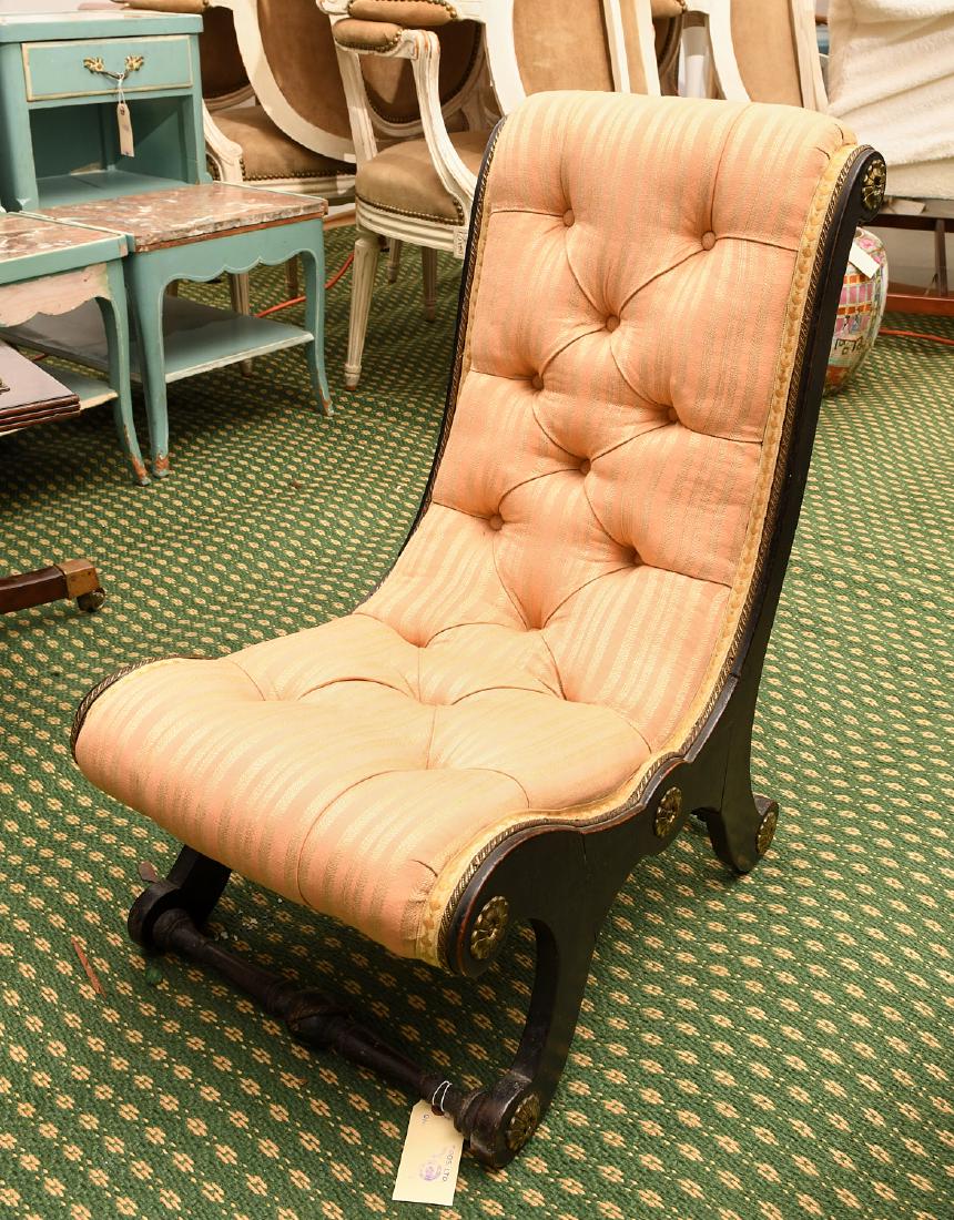 Regency style ebonized slipper chair: Regency style ebonized slipper chair, 20th c., applied gold finish rosettes and rope trim, 26"h x 14.5" x 19"d
