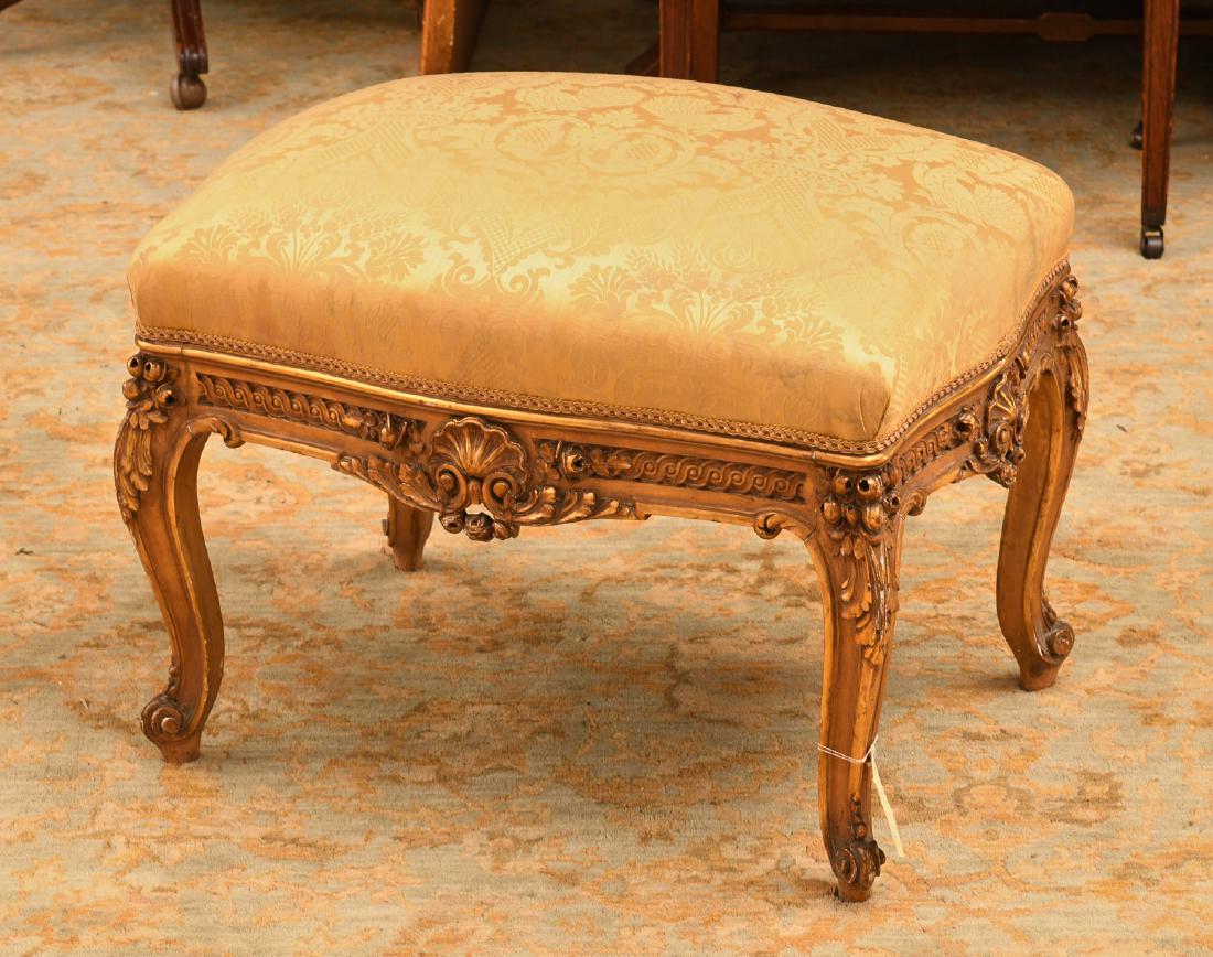 Nice Louis XV style carved and giltwood stool: Nice Louis XV style carved and giltwood stool, 19th/20th c., gold damask upholstery, 18.5"h x 25.5"w x 17.5"d