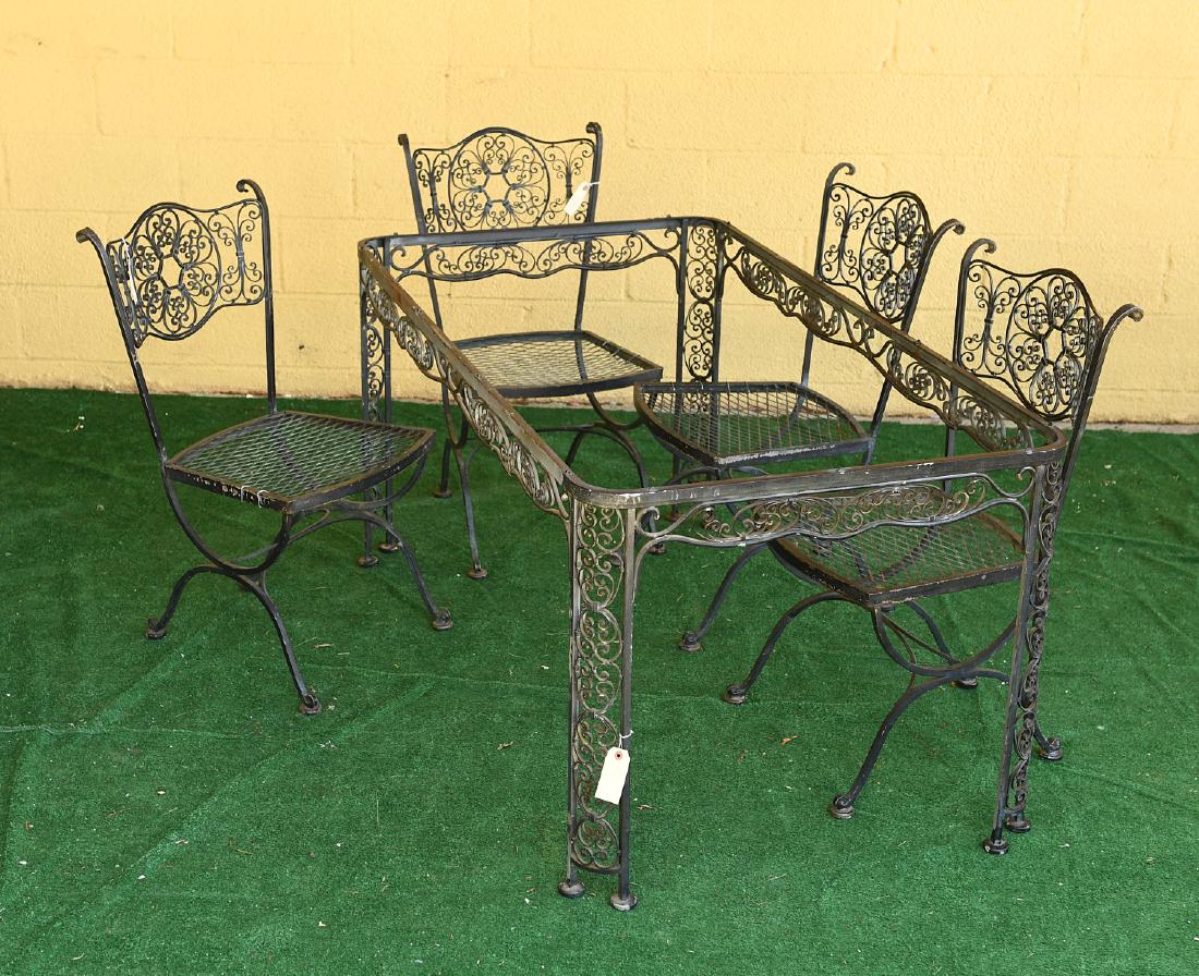 Wrought iron Filigree garden table and (4) chairs: Wrought iron Filigree garden table and (4) chairs, 20th c., table: 29"h x 60.5"l x 33"w, chairs: 35"h x 19"w x 20"d