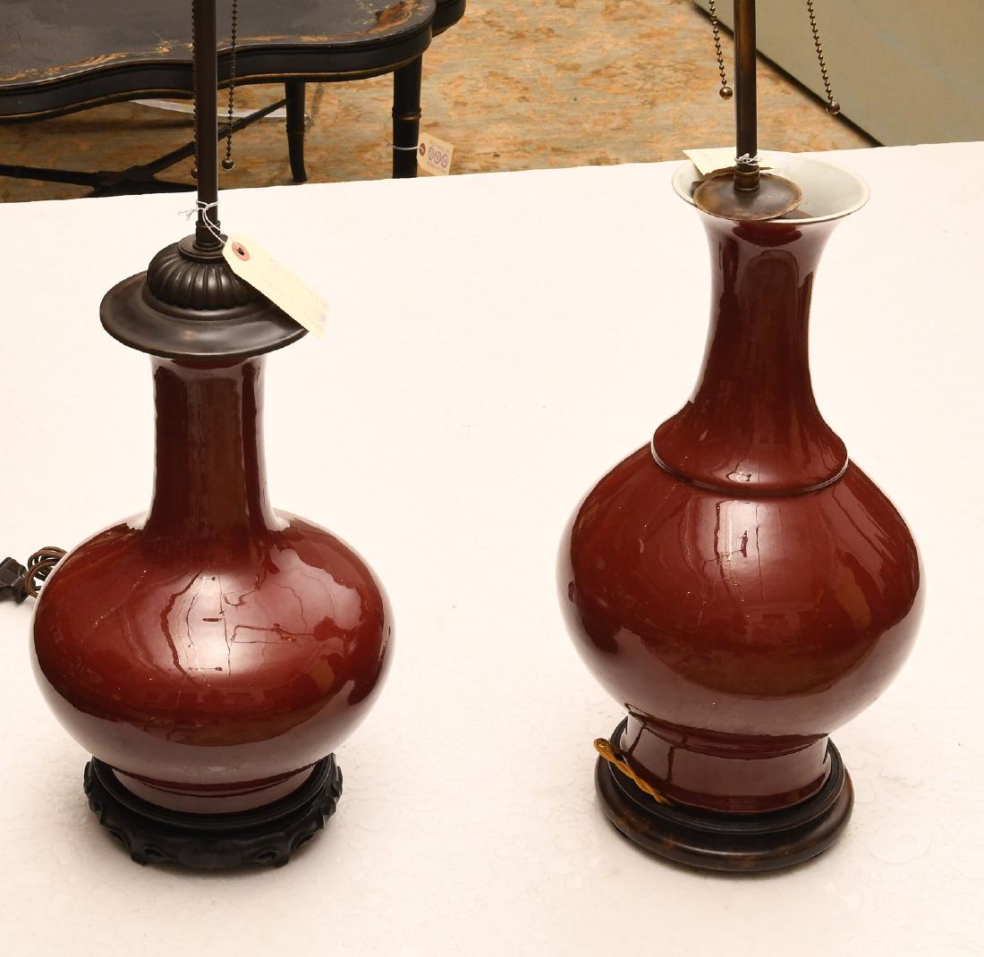 (2) Chinese porcelain oxblood vase lamps (1 of 7)