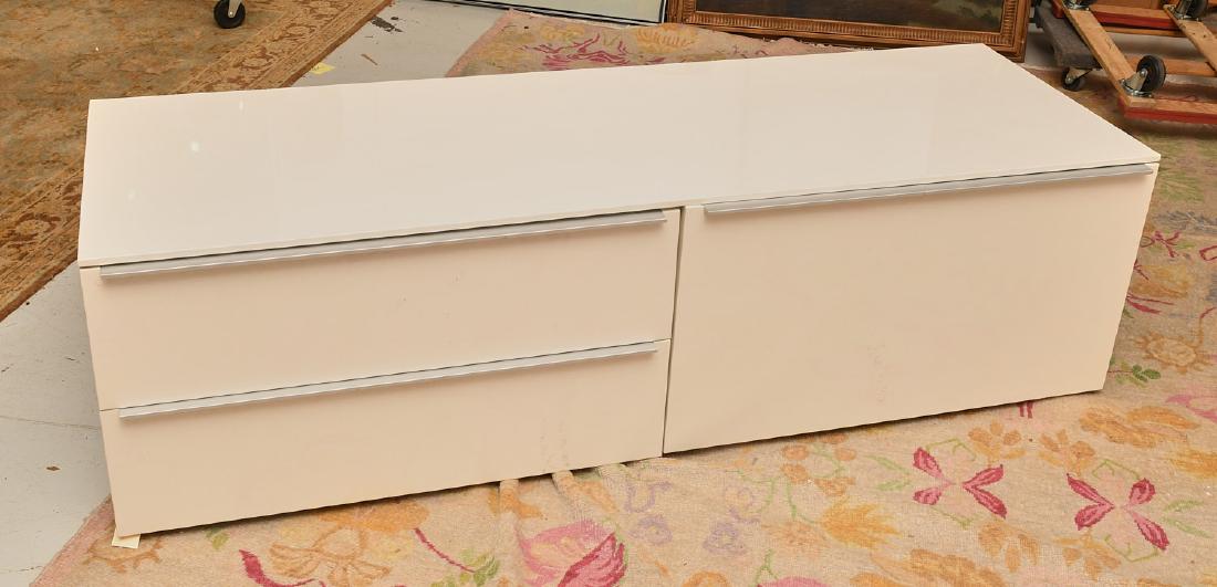 Cappellini white lacquered cabinet: Cappellini white lacquered cabinet, c. 2007, Italy, three drawer cabinet finished in white piano lacquer with aluminum pulls, 20"h x 71"l x 24"w