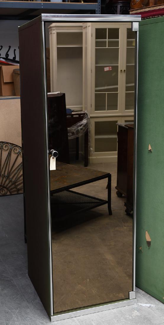 I4 Mariani for Pace mirrored wardrobe cabinet: I4 Mariani for Pace mirrored wardrobe cabinet, 20th c., designed by Guido Faleschini, green upholstered exterior with chromed metal piping and hardware, mirrored fronts, brown upholstery lined interio