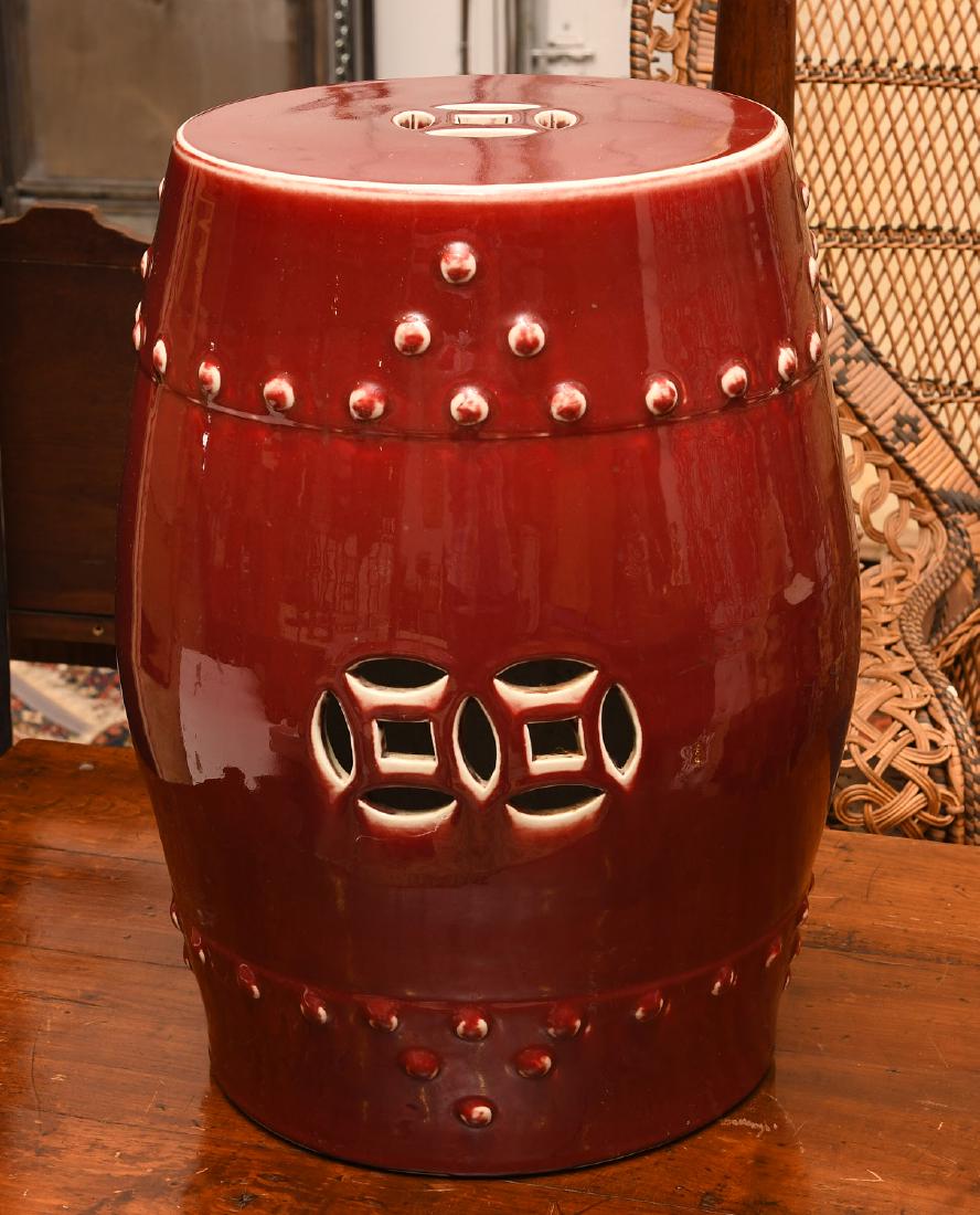 Chinese oxblood porcelain garden seat: Chinese oxblood porcelain garden seat, 20th c., unmarked, 18.5"h x 12.5"w, 10.75"dia. (at top)