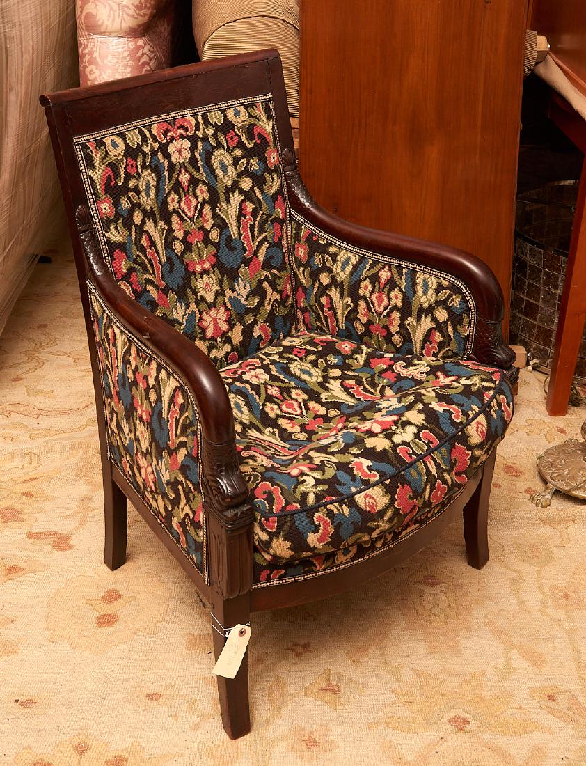 French Empire carved mahogany bergere: French Empire carved mahogany bergere, 19th c., dolphin-carved arms, needlepoint style upholstery, 36"h x 25"w x 19"d
