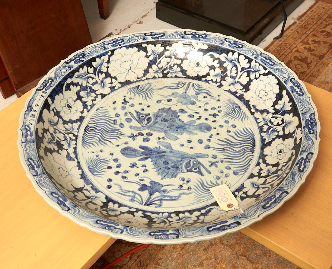 Very large Chinese blue/white porcelain charger: Very large Chinese blue/white porcelain charger, Qing Dynasty or later, blue and white porcelain with gold highlights, Ming style marks to rim, 4"h x 28"dia.