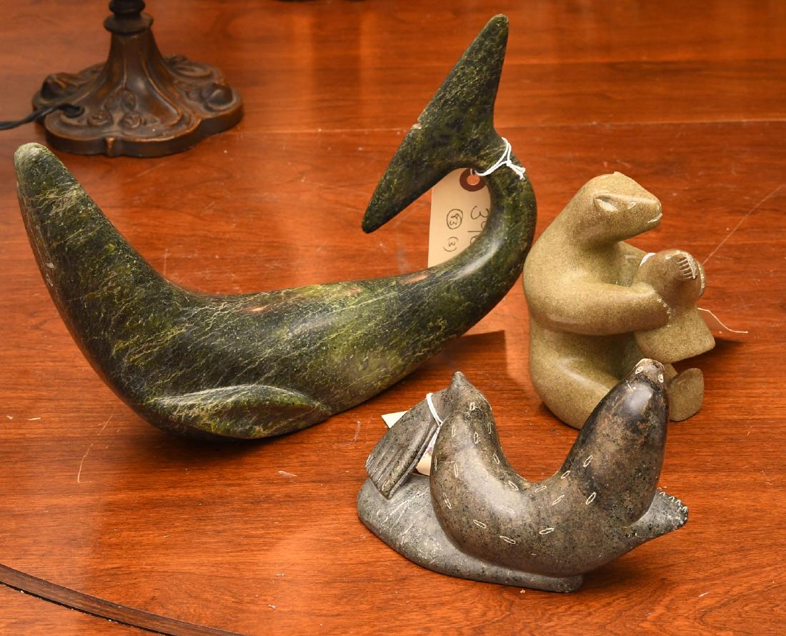 (3) Inuit soapstone carvings: (3) Inuit soapstone carvings, 20th c., incl. a Canadian polar bear, Eskimo Art sticker to underside of leg, a Lucassie Amm seal, signed and dated 1978 to underside, and whale, with syllabic artist nam