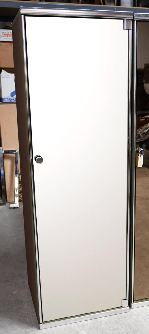 I4 Mariani for Pace mirrored wardrobe cabinet: I4 Mariani for Pace mirrored wardrobe cabinet, 20th c., designed by Guido Faleschini, green upholstered exterior with chromed metal piping and hardware, mirrored fronts, brown upholstery lined interio