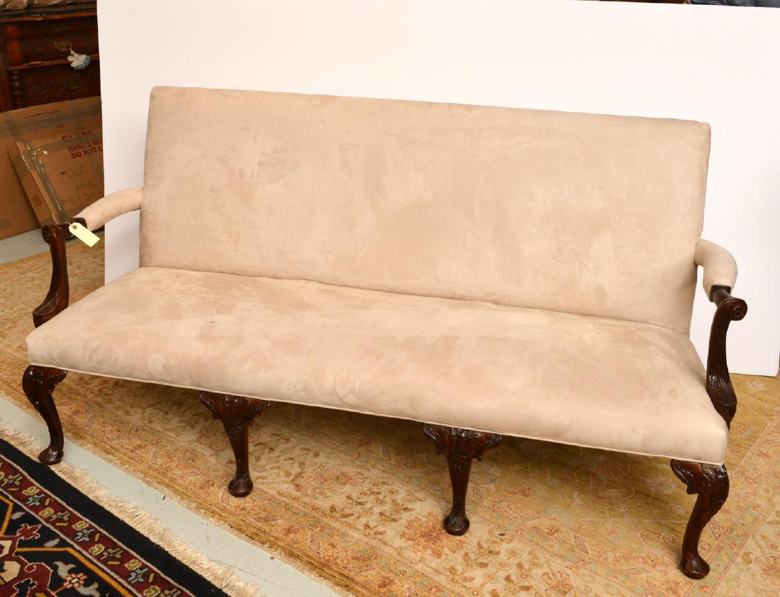 George III style carved mahogany sofa: George III style carved mahogany sofa, 19th/20th c., fancy carved arms and knees on pad feet, ultra suede upholstery, 37"h x 71"l x 29"d, 17"h (to seat)