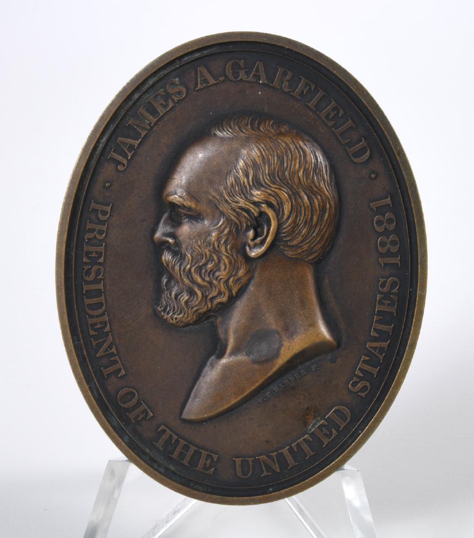 1881 Garfield Indian Peace Medal, bronze oval: 1881 Garfield Indian Peace Medal, bronze oval, 1881 James A. Garfield Peace Medal, bronze, dark bronze color, approx. 76 mm x 59 mm Provenance: Property from the Collection of Charles E. Sigety; Early