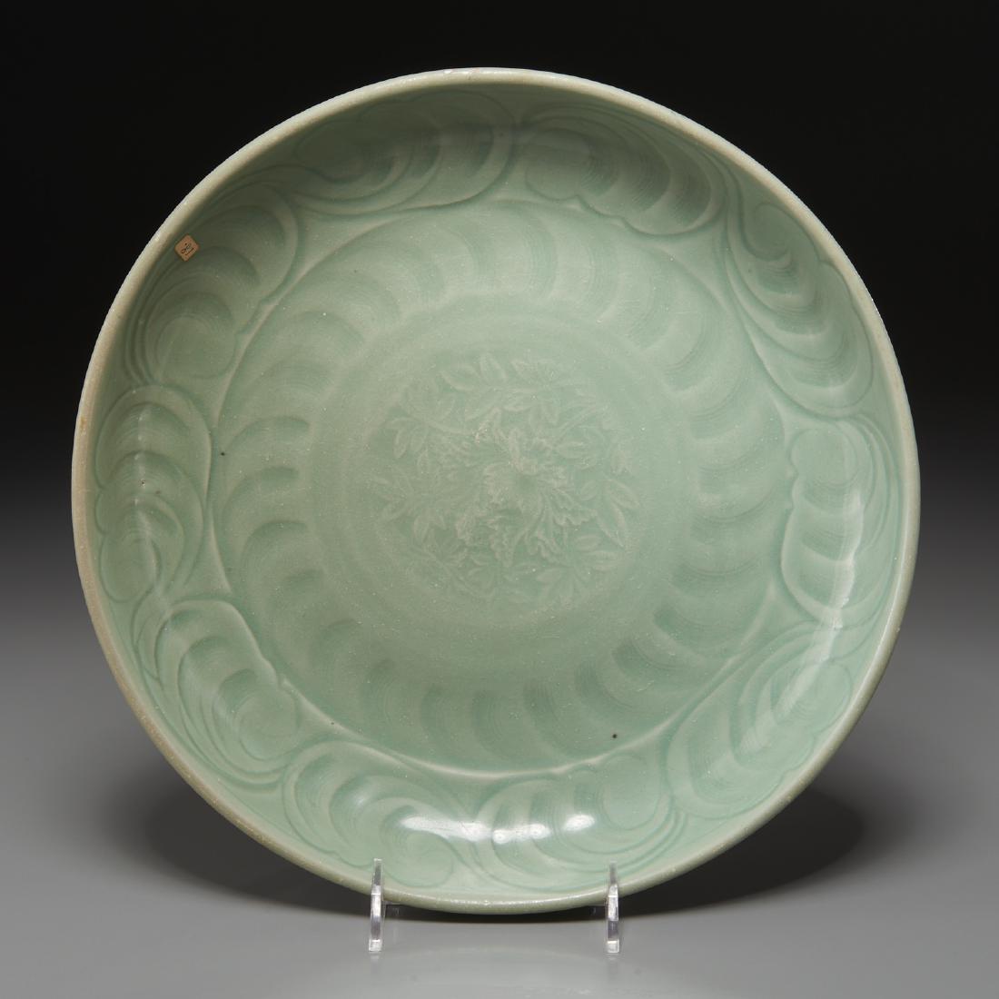 Large Longquan celadon porcelain bowl: Large Longquan celadon porcelain bowl, Likely Ming Dynasty (14th-17th c.), the interior decorated with incised blossoms and foliate scrolled edge, paper inventory label to bowl interior, unmarked, 2"h