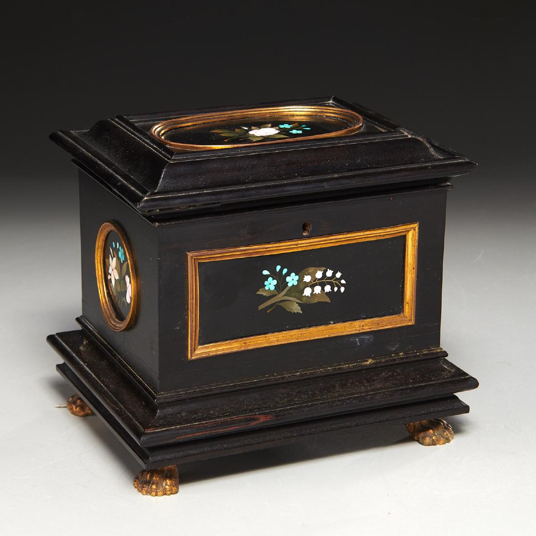 Italian pietra dura paneled ebony casket box: Italian pietra dura paneled ebony casket box, 19th, Italy, mixed stone inlay, gilt brass trim and paw feet, velvet lined interior, 6"h x 6"w x 4.5"d Provenance: Property of a Distinguished New York Ci