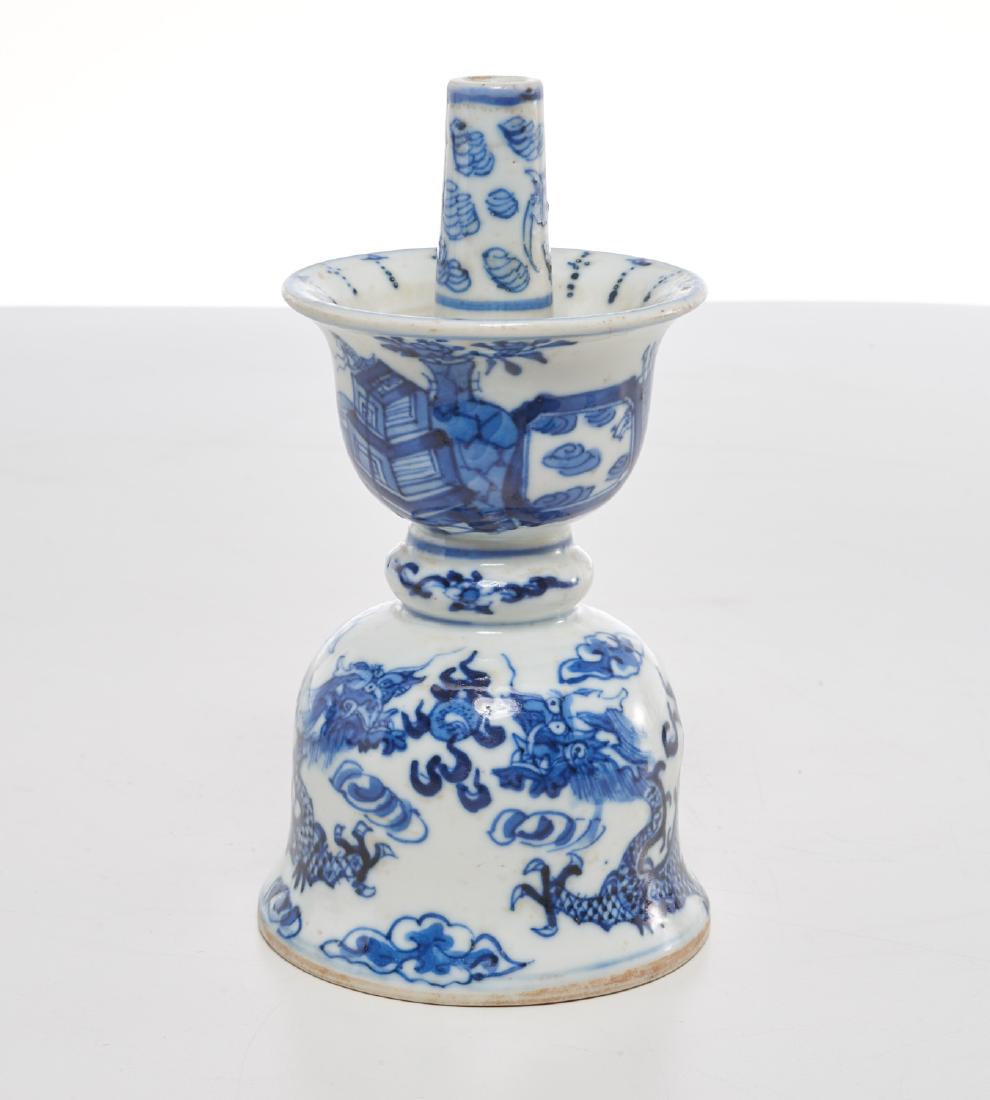 Chinese blue and white porcelain joss stick holder: Chinese blue and white porcelain joss stick holder, Qing dynasty (19th/20th c.), bell form, painted with dragon and cloud motifs, 6.75"h x 3.5"dia