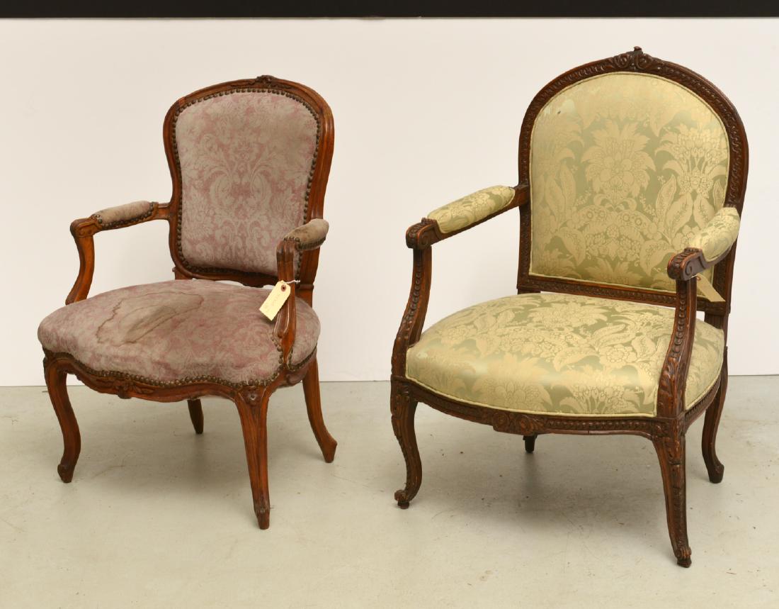 (2) old Louis XV style fauteuils: (2) old Louis XV style fauteuils, 19th/20th c., each with carved frames and damask upholstered backs, seats, and arms, 37.75"h x 26"w x 21"d (larger), 34.5"h x 25"w x 19.5"d (smaller)