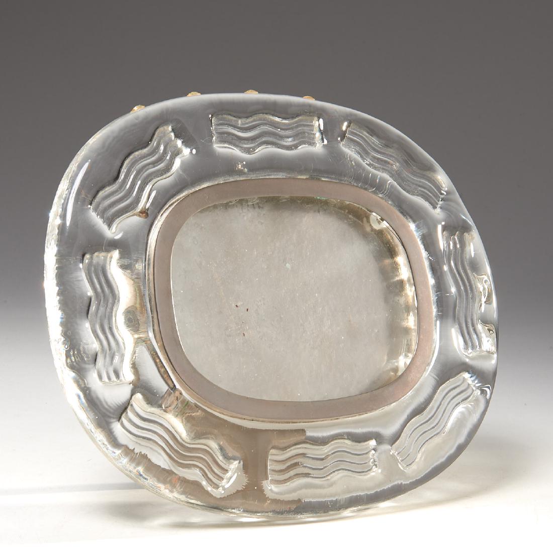 Rudolf Jurnikl (attrib.) picture frame: Rudolf Jurnikl (attrib.) picture frame, c. 1970, Czechoslovakian, clear glass molded with wave decoration, silver plate rim and stand, unsigned, 9"h x 12"w Provenance: Property removed from a Hewlett 