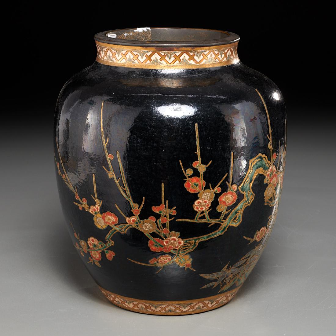Japanese Satsuma vase: Japanese Satsuma vase, Meiji Period (19th c.), gilt and polychrome enameled pottery, bronze rim, the body decorated with flowering branches on a black ground, unmarked, 11"h x 9"dia Provenance: From a