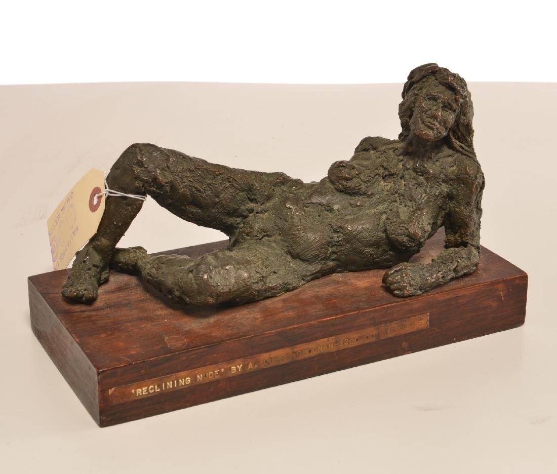 A. Curry Cloonan, bronze sculpture: A. Curry Cloonan, bronze sculpture, A. Curry Cloonan (American, 20th c.), "Reclining Nude", bronze sculpture, mounted on wooden base, no visible signature, sticker label affixed to base, 6.5"h x 10.25