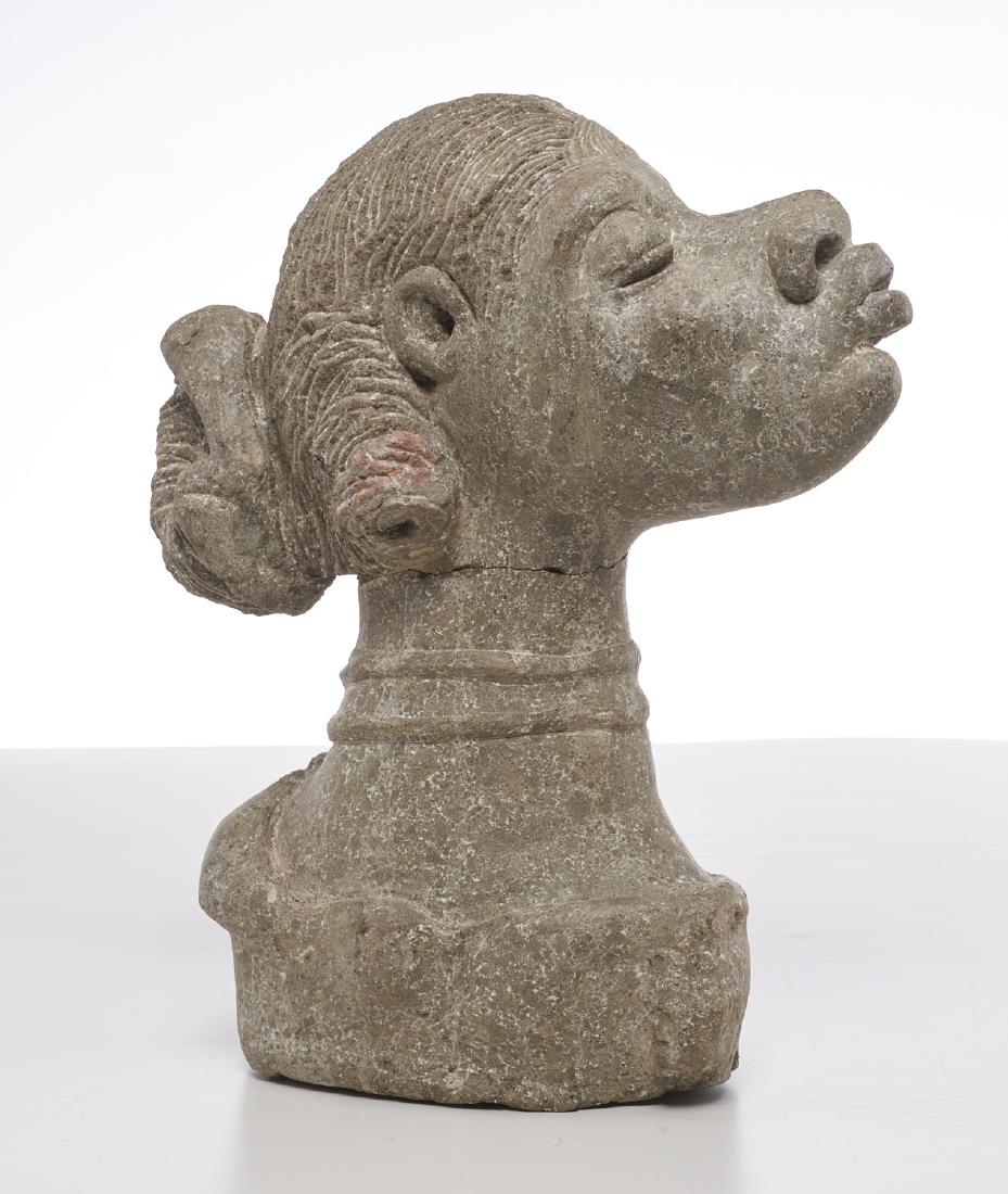 Carved stone sculpture of a woman (1 of 9)