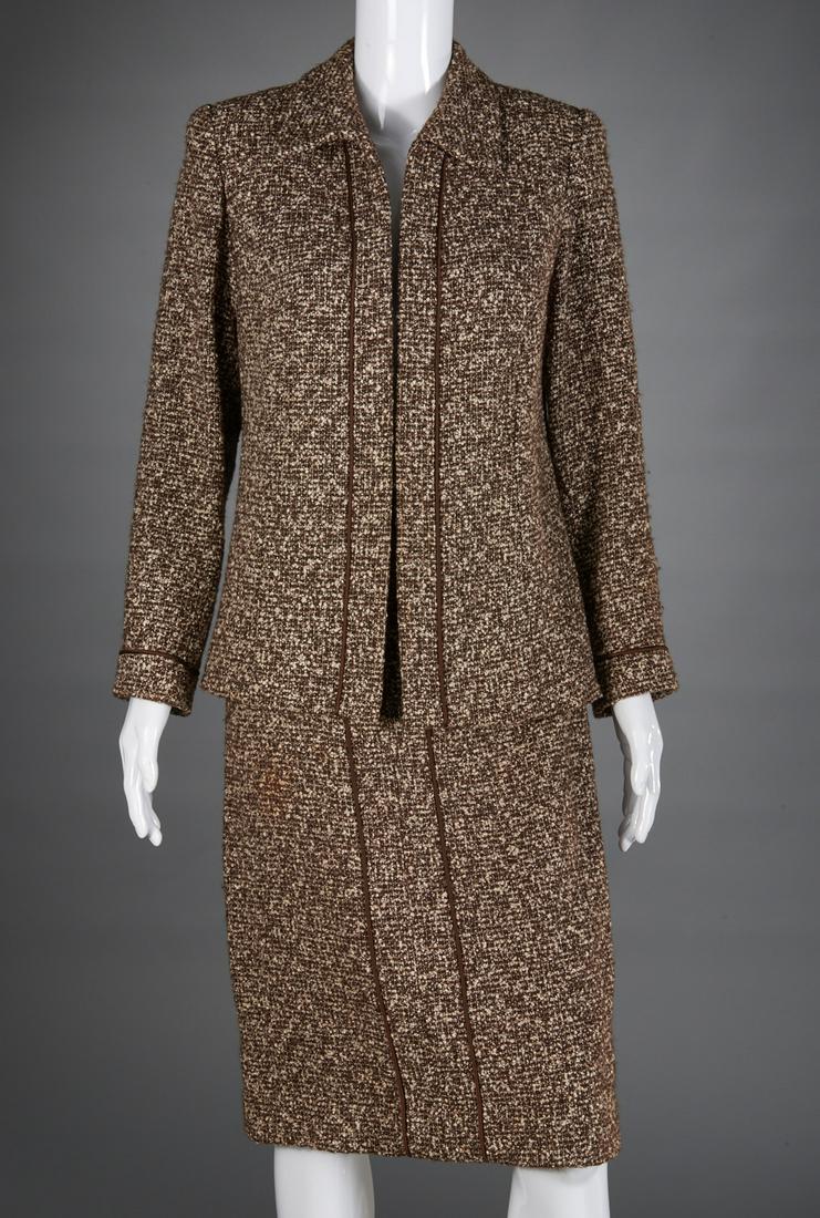 Ladies Akira Isogawa brown boucle suit: Ladies Akira Isogawa brown boucle suit, late 20th c., open front jacket with brown satin piping, silk lined, approx. 38"b, 23"sl, 26"l, slim skirt with piping trim, back slit, approx. 30"w, 26"l Prove