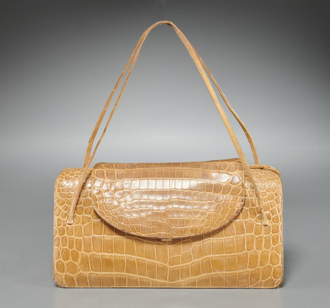 Vintage Judith Leiber tan crocodile handbag: Vintage Judith Leiber tan crocodile handbag, c. 1970's, foldover flap closure, double strap handles, accordian bottom with (3) interior sections, gold embossed signature, approx. 5.5"h x 10.5"w, 6.5"