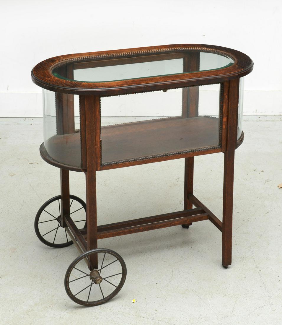 Arts & Crafts oak and glass vitrine trolley: Arts & Crafts oak and glass vitrine trolley, Early 20th c., beaded trim, 30"h x 31"w x 16.5"d