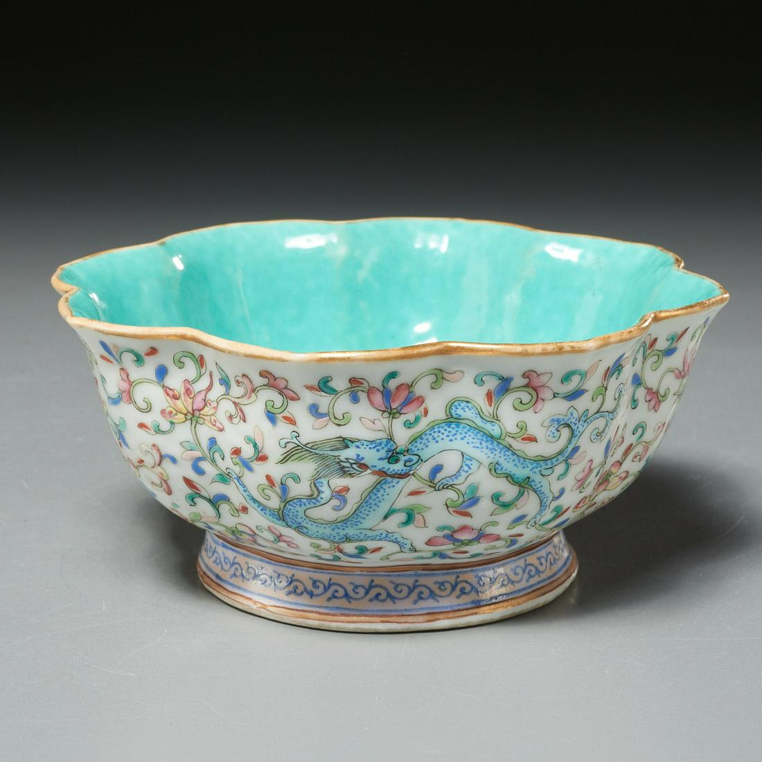 Chinese famille rose dragon bowl: Chinese famille rose dragon bowl, Qing Dynasty (19th c.), polychrome enameled porcelain, the exterior decorated with a red, blue, and yellow dragon on a floral ground, the interior enameled, overglaze