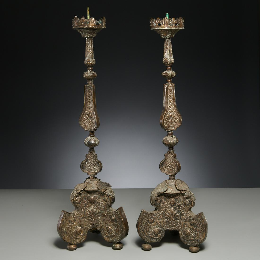 Pair Italian Baroque silvered copper altar sticks: Pair Italian Baroque silvered copper altar sticks, 17th/18th c., repousse foliate decoration, 32"h x 9.5"dia (at base)