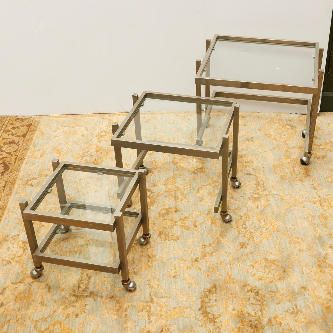 Set (3) Modernist aluminum & glass nesting tables: Set (3) Modernist aluminum & glass nesting tables, Mid 20th c., on ball casters, 18.5"h x 20"squ (largest), 13"h x 11.75"squ (smallest)