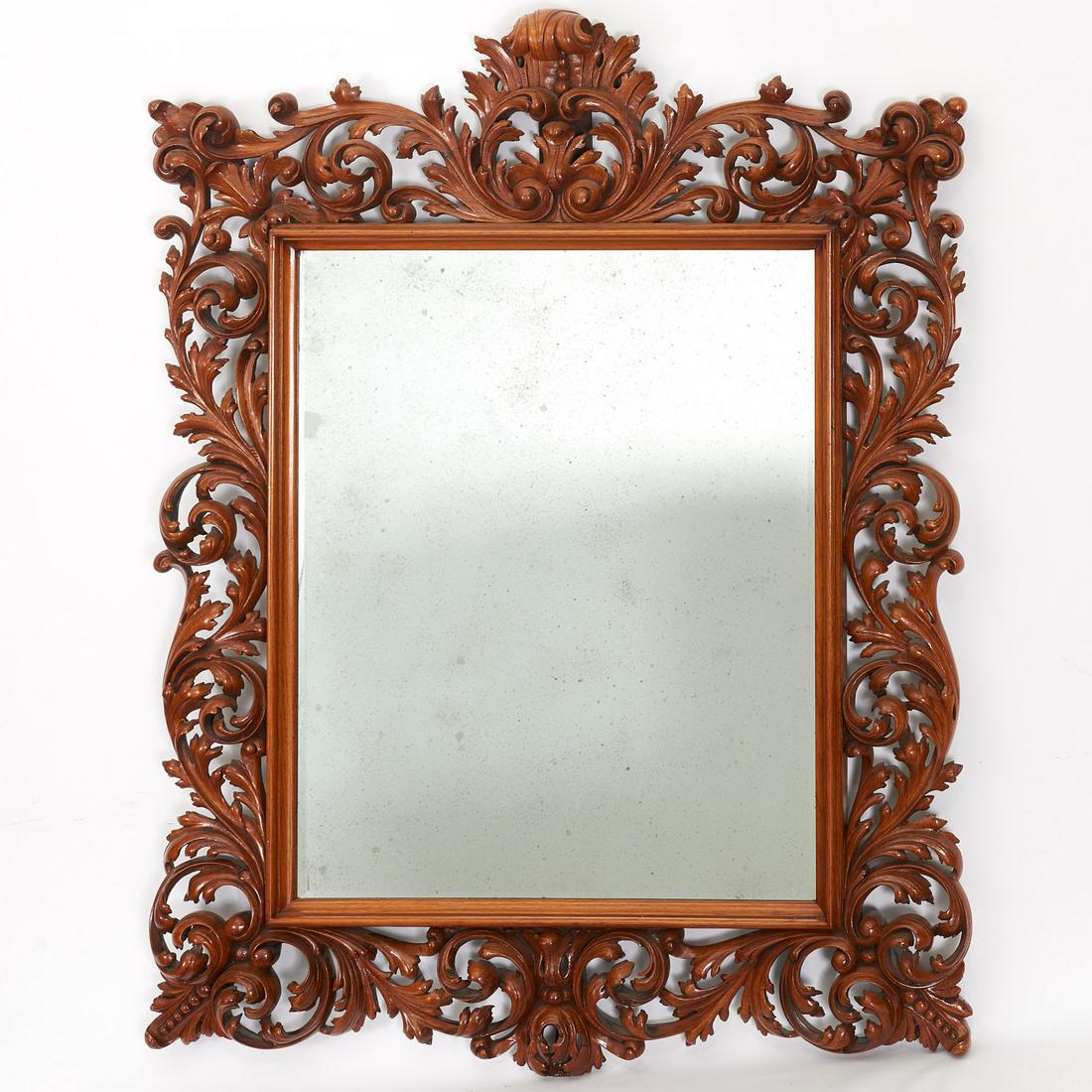Large Italian Rococo carved walnut mirror: Large Italian Rococo carved walnut mirror, Mid 19th c., Italy, rectangular mirror plate with elaborately pierce-carved foliate frame, 56"h x 44"w Provenance: Property removed from 993 Fifth Avenue