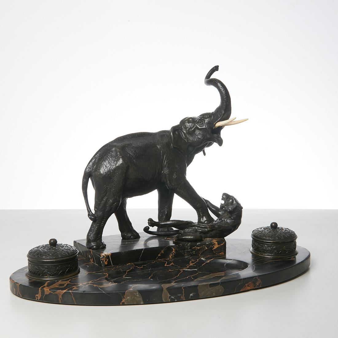 A.L. Barye style bronze elephant ink stand: A.L. Barye style bronze elephant ink stand, 20th c., elephant attacking a tiger, brown/black patina, double inkwell on portaro nero marble base, unmarked, 14"h x 20"w x 9.25"d