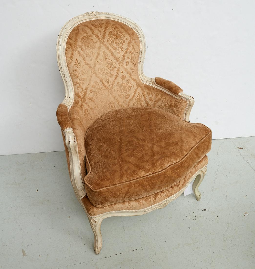 Antique Louis XV style white painted bergere: Antique Louis XV style white painted bergere, First half 20th c., floral textured taupe velveteen fabric, cream painted, floral carved crest, apron, and knees, 36"h x 27.5"w x 22"d
