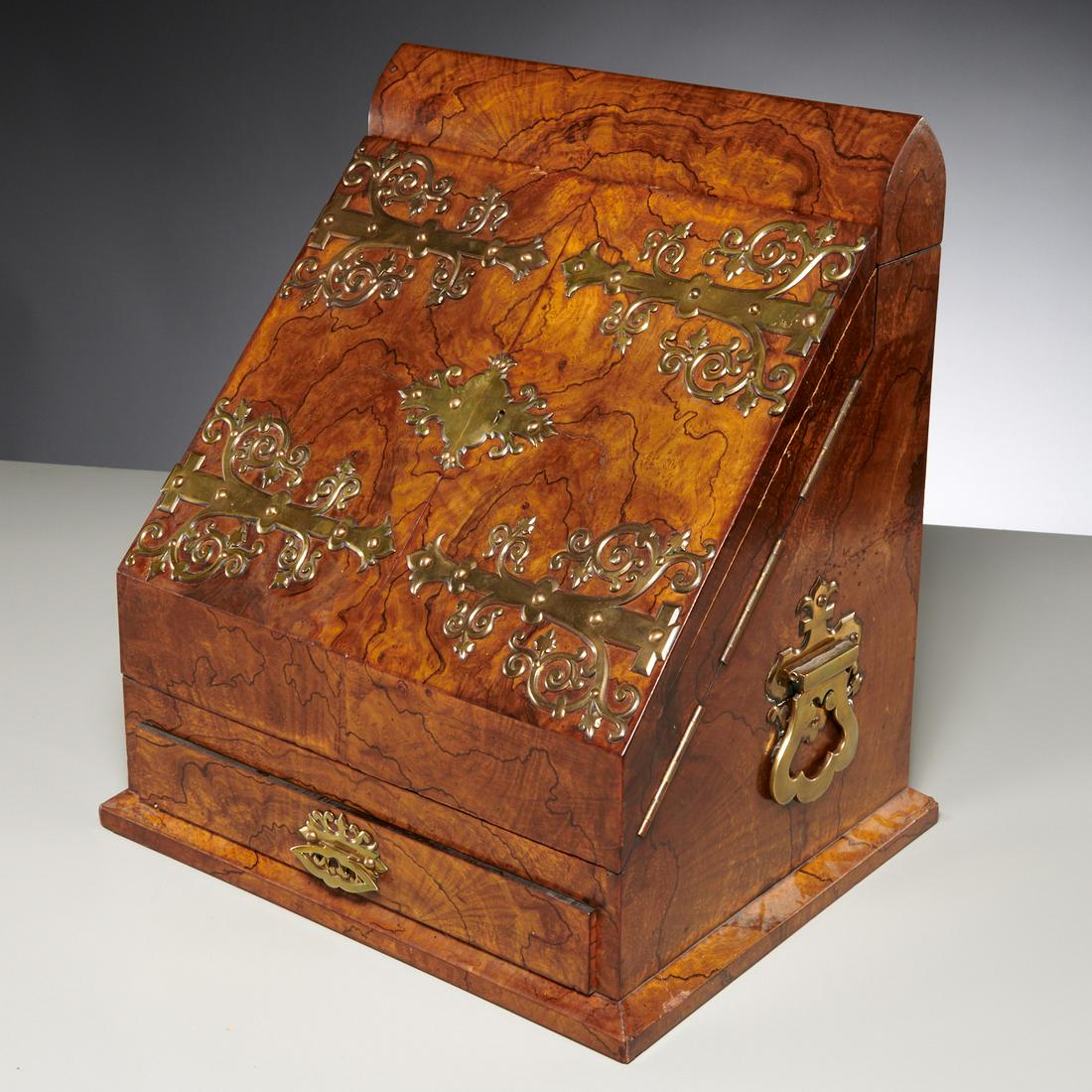 Jenner & Knewstub Victorian tabletop secretary: Jenner & Knewstub Victorian tabletop secretary, Second half 19th c., England, the slant front case veneered in highly figured mahogany burl, with gothic style brass mounts, two hinged doors opening to