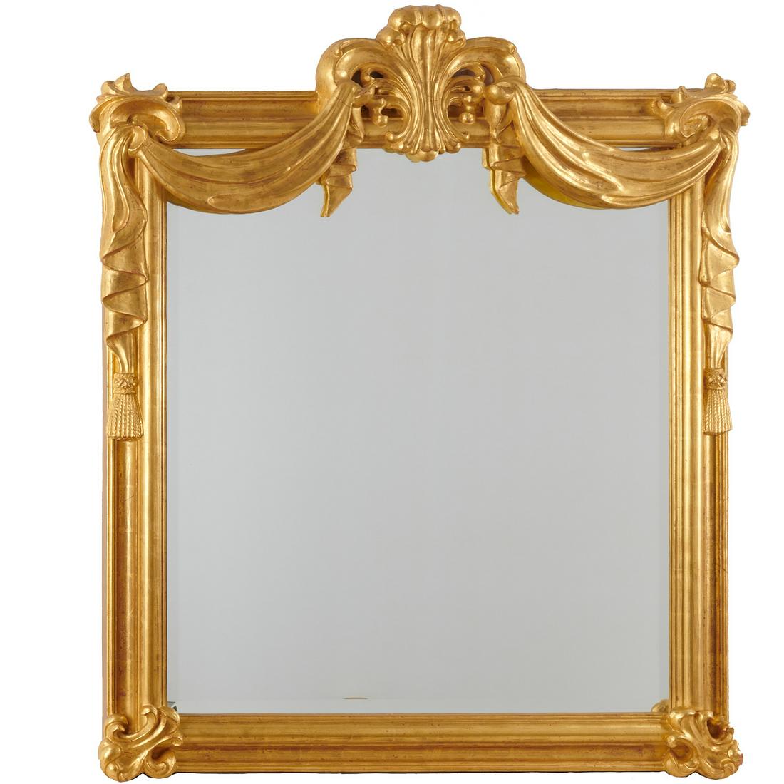 Large Italian Rococo style giltwood mirror: Large Italian Rococo style giltwood mirror, 20th c., thickly gilt and deeply carved frame topped with trefoil crest hung with tasseled drapery, 55"h x 46"w Provenance: Property removed from 993 Fifth 