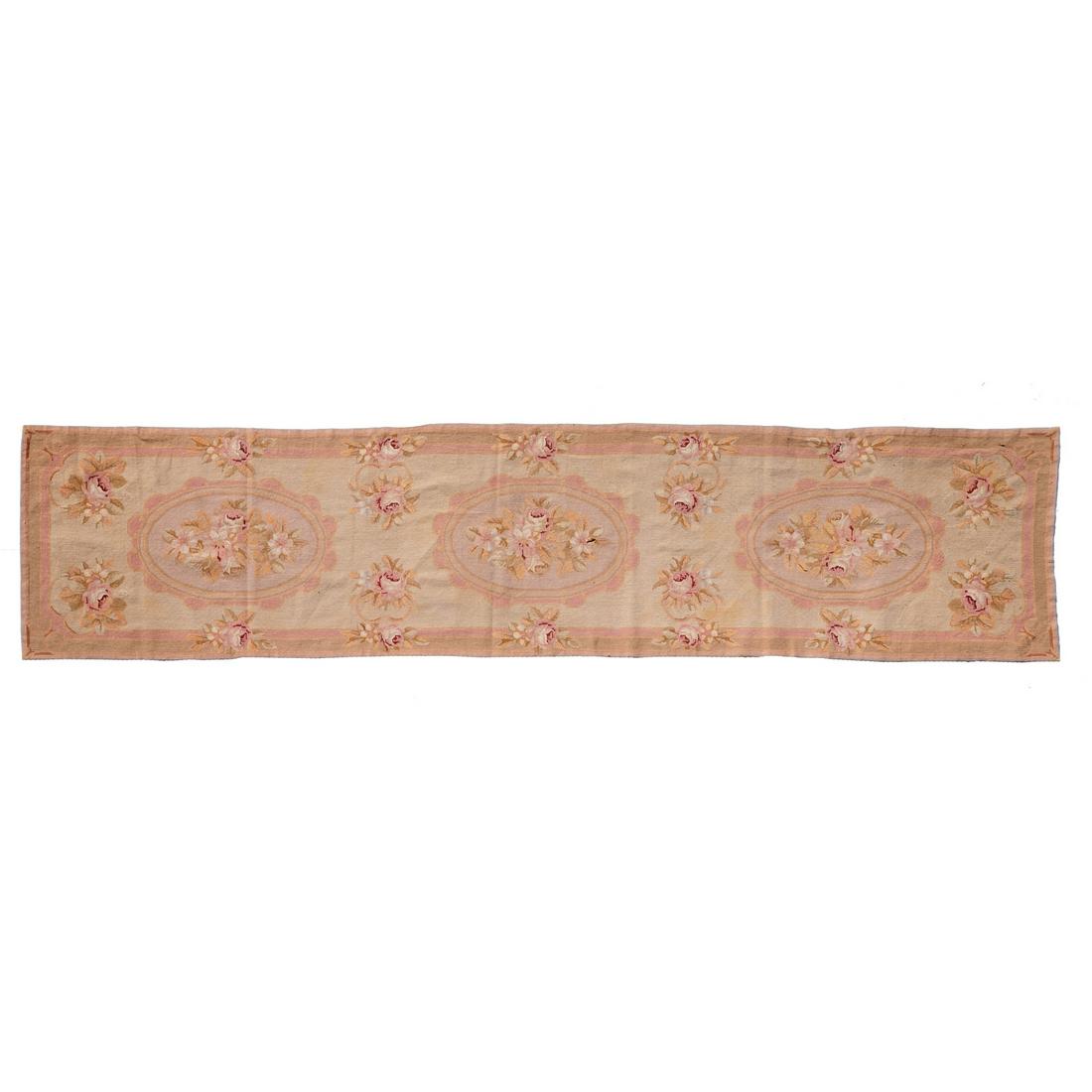 Aubusson-style needlepoint runner: Aubusson-style needlepoint runner, 20th c., hand-woven wool, decorated with pink and red rose clusters on a pale cream ground, 118"l x 27"w