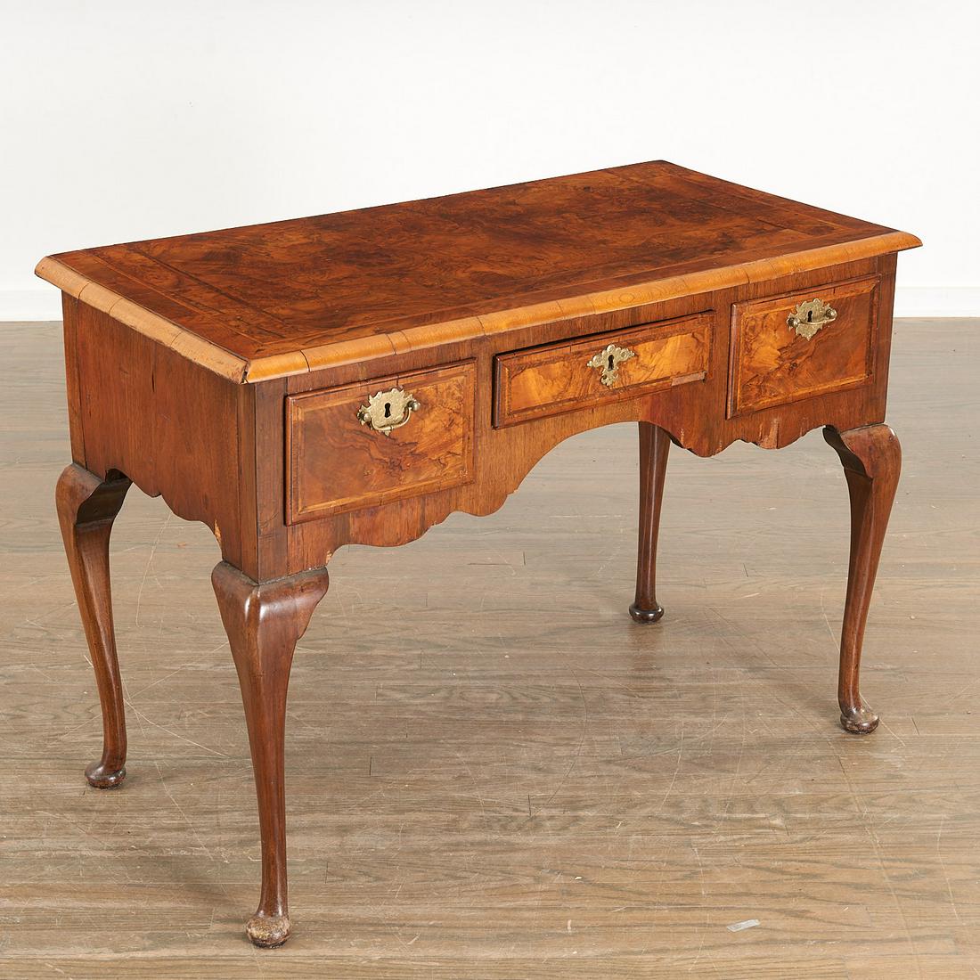 George II style inlaid burlwood dressing table: George II style inlaid burlwood dressing table, 19th c. figured walnut veneer, brass pulls, with shaped skirt and cabriole legs, 30"h x 42"l x 21"d Provenance: The Collection of Shirley and Harold Lev