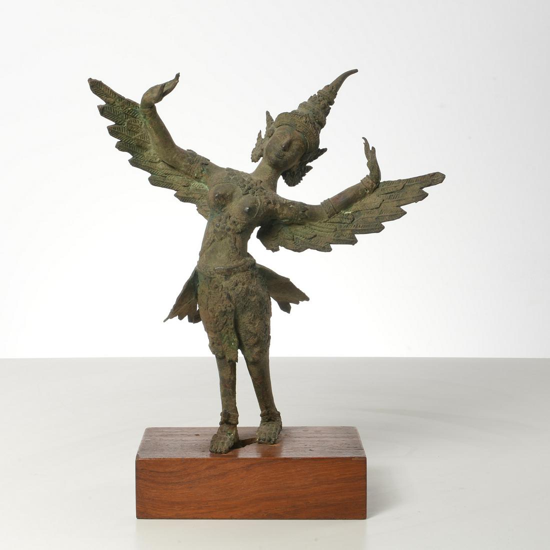 Antique Thai bronze of a winged female deity: Antique Thai bronze of a winged female deity, Bangkok Period or earlier, mounted on wooden plinth, 14.5"h x 11.5"w x 6"d