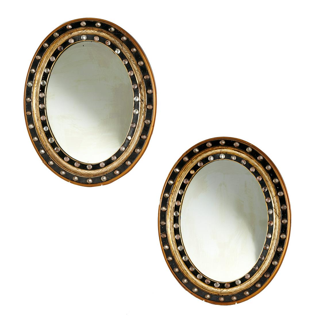Pair Irish Regency Ebonized and Jeweled Mirrors: Pair Irish Regency Ebonized and Jeweled Mirrors, 19th c., oval in shape and mounted with paste jewels, 18" h x 15" w Provenance: The Collection of Elizabeth "Betty" Seeler